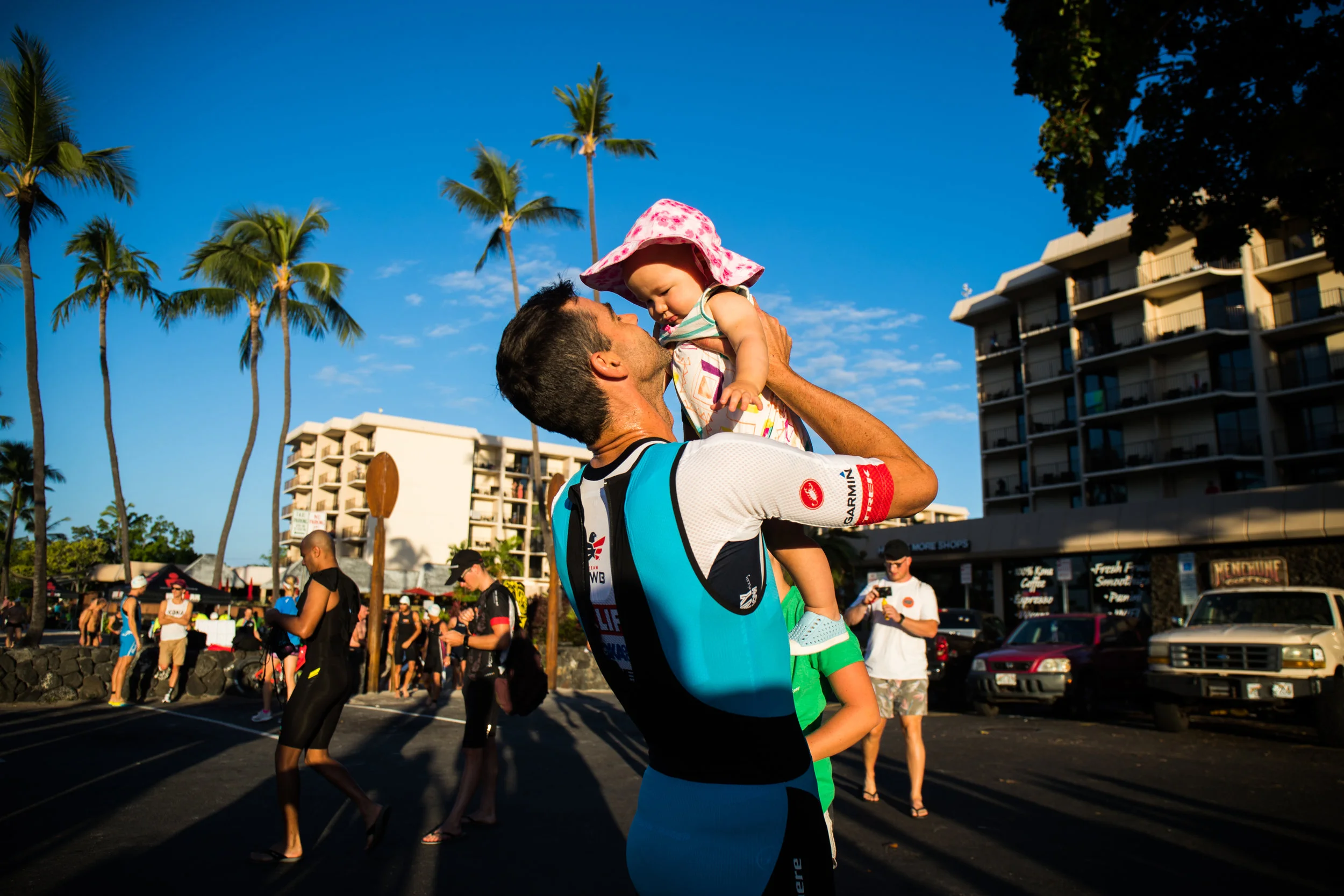 Tim with his daughter after a race in Kona