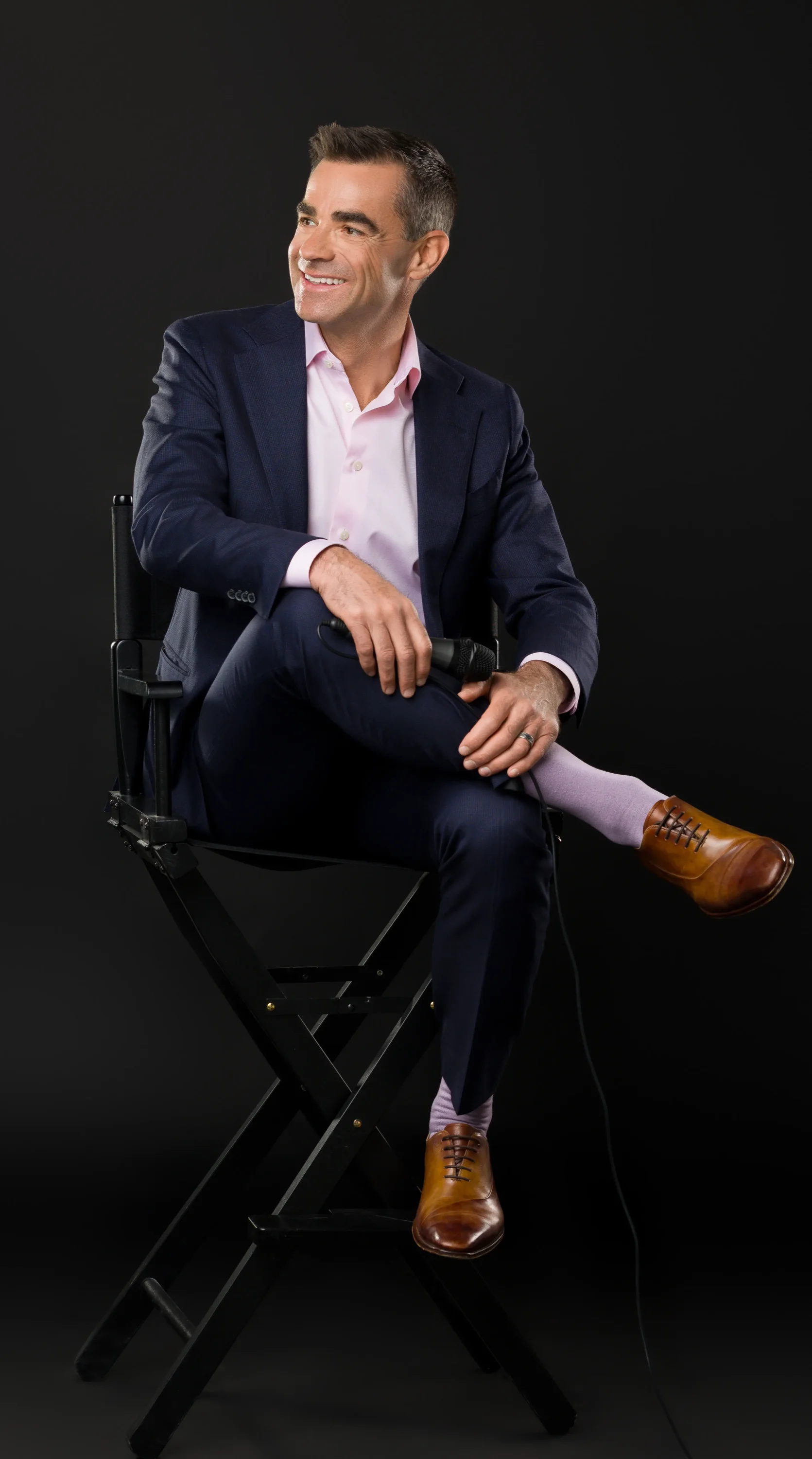 Tim O'Donnell — editorial portrait, seated with mic